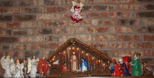 This ceramic Nativity was hand-painted by the author and has been the main feature for household decor for over 30 years.