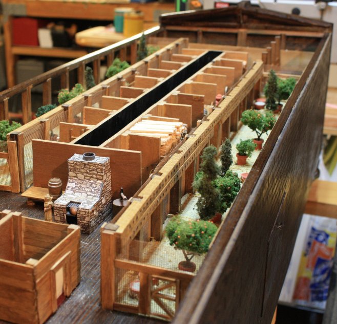 Detail showing stone oven, forward starboard side aviary and storage